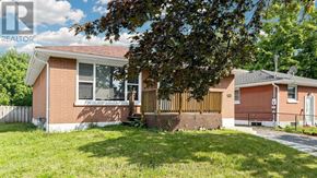 Oshawa (Donevan) apartment for rent - A red brick house with a white door and a small porch.