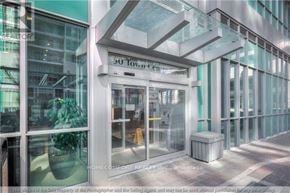 Toronto (Bendale) house for rent - The entrance to a building with a glass facade and a sign that reads "50 Town Centre".