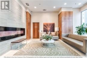 Toronto (Bendale) house for rent - A modern living room with a fireplace and a large mirror on the wall.