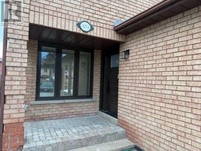 Mississauga (Fairview) apartment for rent - A brick building with a window and a door.