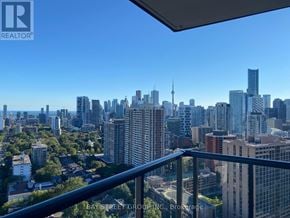Toronto (Cabbagetown-South St. James Town) condo for rent - A cityscape viewed from a balcony with the Bay Street Group logo.