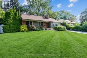 Mississauga (Lakeview) apartment for rent - A house with a lawn in front of it.
