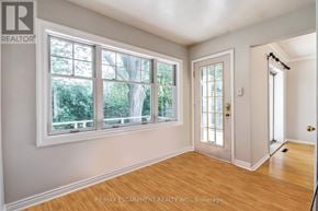Mississauga (Lakeview) apartment for rent - A room with a door, windows and wooden floors.