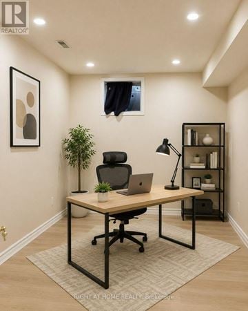 Oakville (Ro River Oaks) apartment for rent - A well-lit home office with a laptop on the desk.