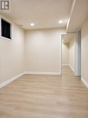 Oakville (Ro River Oaks) apartment for rent - A room with a wooden floor and white walls.