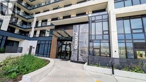 Oakville (Jm Joshua Meadows) condo for rent - The image shows the front of a building with the sign "WEB MAX REALTY INC. Brokerage" on the glass door.
