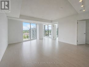 Toronto (Humber Heights) condo for rent - A spacious room with a view of the city through the windows.