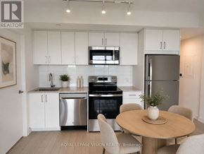 Toronto (Humber Heights) condo for rent - A modern kitchen with white cabinets and stainless steel appliances.