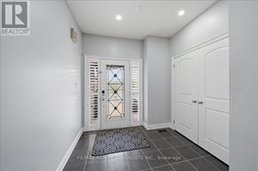 Bradford West Gwillimbury (Bradford) apartment for rent - A hallway with a glass door and a tiled floor.