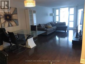 Toronto (Bay Street Corridor) condo for rent - A living room with a grey couch and a glass table.