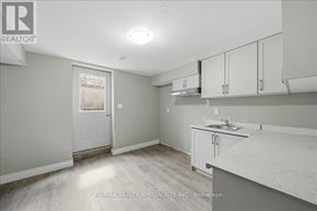 Bradford West Gwillimbury (Bradford) apartment for rent - A kitchen area with a sink and cabinets.