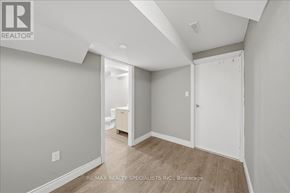 Bradford West Gwillimbury (Bradford) apartment for rent - A room with a white door and a white cabinet in the background.
