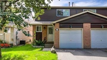 Markham (Thornhill) apartment for rent - A house with a brown roof and a white garage door.