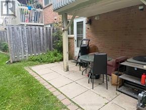 Markham (Thornhill) apartment for rent - A patio area with a table and chairs outside a house.