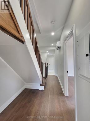 Toronto (Junction Area) duplex for rent - A hallway with wooden floors and white walls.