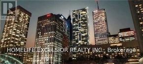 Toronto (Bay Street Corridor) condo for rent - A cityscape at night with the text "HOMELIFE EXCELSIOR REALTY INC., Brokerage" superimposed on the image.