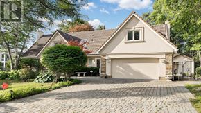 Markham (Bayview Glen) apartment for rent - A house with a driveway and a garage.