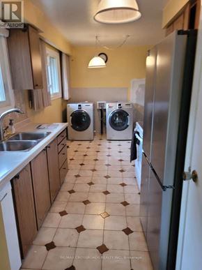 Richmond Hill (Crosby) apartment for rent - A kitchen with a tile floor and a refrigerator.