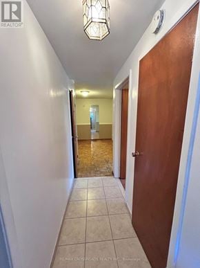 Richmond Hill (Crosby) apartment for rent - A hallway with a wooden door and tiled floor.