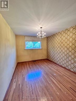 Richmond Hill (Crosby) apartment for rent - A room with wooden flooring and a chandelier.