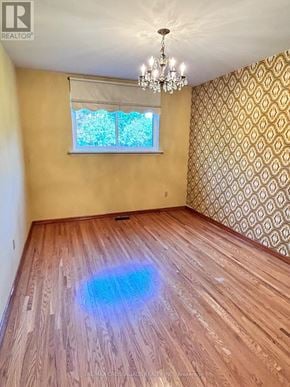 Richmond Hill (Crosby) apartment for rent - A room with wooden flooring and a chandelier.