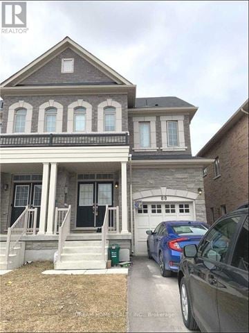 Markham (Cedarwood) apartment for rent - A house with a car parked in front of it.