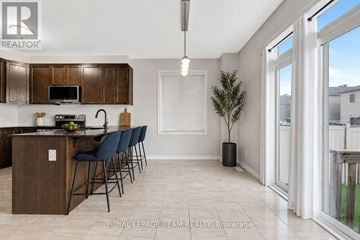 Ottawa apartment for rent - A kitchen with a dining table and chairs.