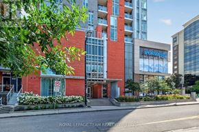 Ottawa condo for rent - A building with a red and white facade is shown with the words "Royal LePage Team Realty Brokerage" on the bottom.