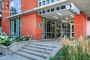 Ottawa condo for rent - A red building with a glass door and a number 118 on it.