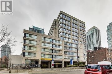 Toronto (Mount Pleasant West) townhouse for rent - A large building with a Royal LePage Signature Realty Brokerage sign in front.