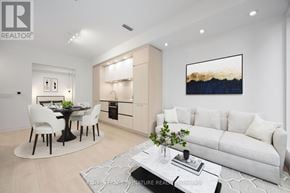 Toronto (Waterfront Communities) condo for rent - A modern living room with a dining table and chairs.