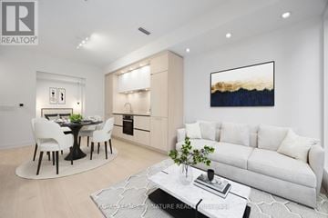Toronto (Waterfront Communities) condo for rent - A modern living room with a dining table and chairs.