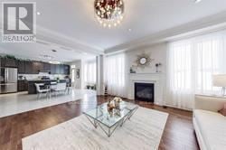East Gwillimbury (Queensville) apartment for rent - A living room with a white couch and a glass coffee table.