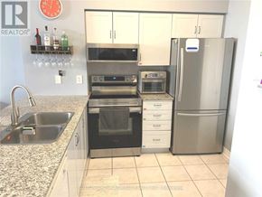 Vaughan (Beverley Glen) condo for rent - A kitchen with a refrigerator, oven, and sink.