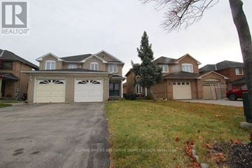 Mississauga (Lisgar) apartment for rent - A house with a driveway in front of it.