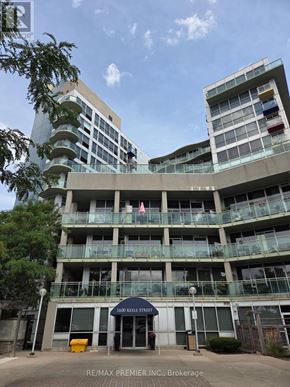 Toronto (Keelesdale-Eglinton West) condo for rent - A large building with a balcony and a blue awning that says 1600 Kelley Street.