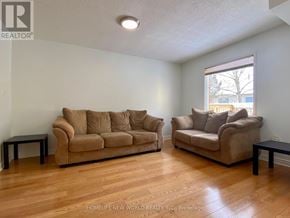 Markham (Markville) apartment for rent - Two couches in a room with wooden floors and a window.