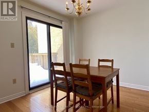 Markham (Markville) apartment for rent - A dining room with a wooden table and chairs.