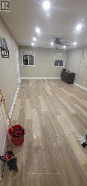 Mississauga (Meadowvale Village) apartment for rent - A room with a ceiling fan and a wooden floor.
