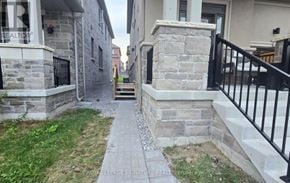 Clarington (Newcastle) apartment for rent - A stone staircase leads up to a house with a sign that says "TEALTO".