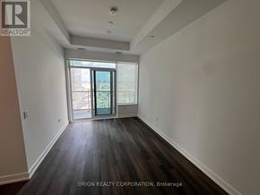 Vaughan (Vaughan Corporate Centre) condo for rent - A room with a sliding glass door leading to a balcony.