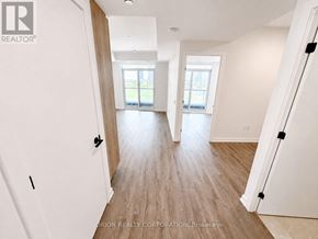 Vaughan (Vaughan Corporate Centre) condo for rent - A spacious room with wooden flooring and white walls.