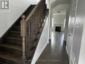 Milton (Cb Cobban) apartment for rent - A staircase with a wooden banister leads to a living room.