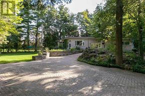 Burlington apartment for rent - A house with a circular driveway in front of it.