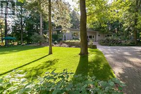 Burlington apartment for rent - A well-maintained lawn with a house in the background.
