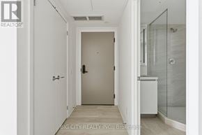 Toronto (Thorncliffe Park) condo for rent - A hallway with a glass door and a white door.