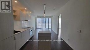 Toronto (Waterfront Communities) condo for rent - A spacious kitchen with a large island in the middle.