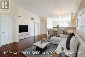 Milton (De Dempsey) condo for rent - A living room with a white couch and a coffee table.