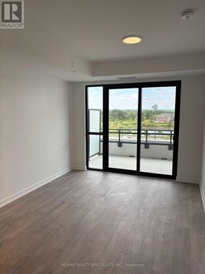Milton (Cb Cobban) condo for rent - A room with a sliding glass door leading to a balcony.