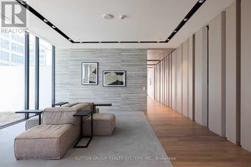 Toronto (Church-Yonge Corridor) condo for rent - A modern living room with a grey sofa and a grey rug.
